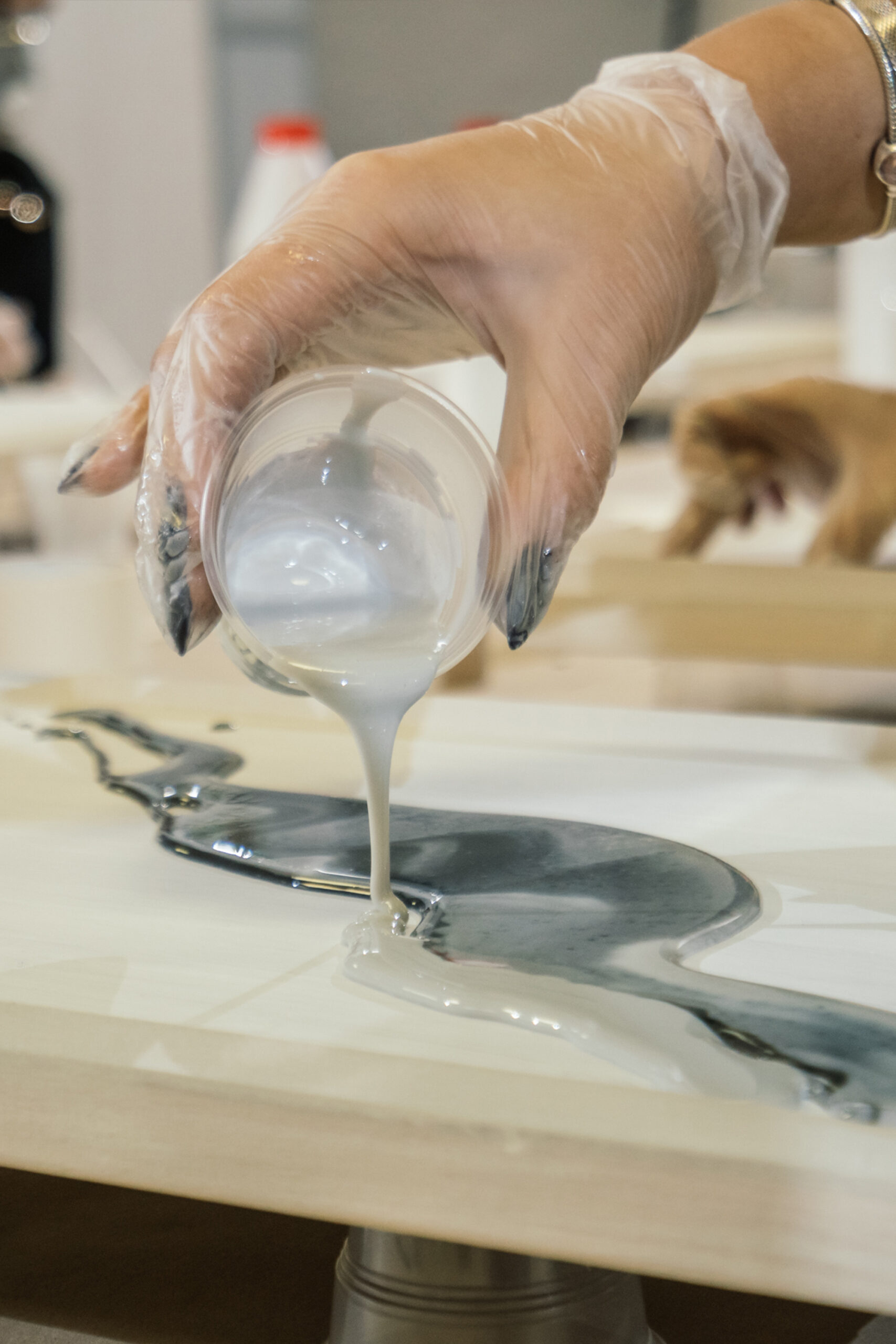 lady pouring out resin