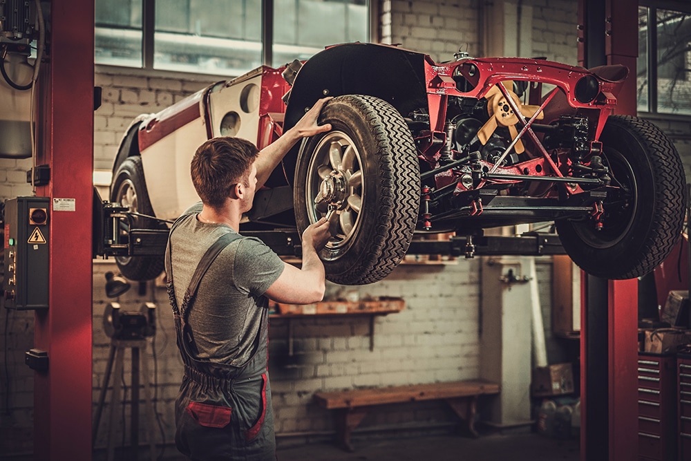 Man restoring a classic car